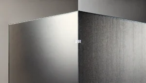 A close-up of two walls side by side. One wall has a glossy finish